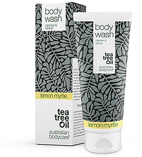 En kroppstvättstub och förpackning med ett lövigt svart och grått design, märkt som citronmyrte tea tree oil.