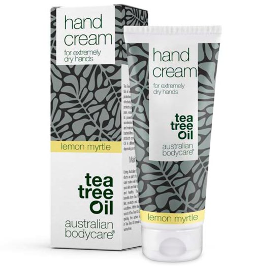 Hand cream in a white tube with black and gray leaf patterns, labeled with tea tree oil and lemon myrtle. 