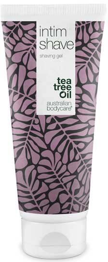 A tube of shaving gel with a purple and black leaf design, labeled as containing tea tree oil for Australian body care.