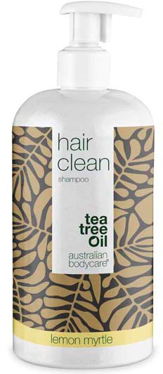 En klar flaske med sjampo merket 'hair clean' med tea tree oil, sitron og myrtle duft, med bladdesign.
