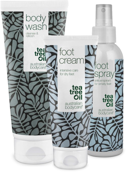Three Australian Bodycare products: body wash, foot cream, and foot spray, all with tea tree oil and leaf patterns.
