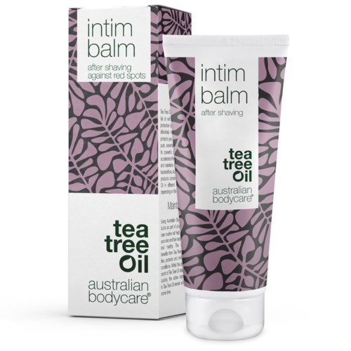 En tub och ett box med aftershave-balsam med tea tree oil. Förpackningen har ett lila och svart mönster och grön text.