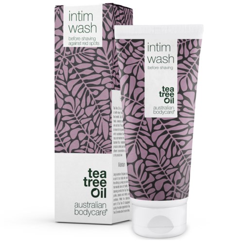 En tube med intimvask med lilla bladmønster, kaldet Tea Tree Oil af Australian Bodycare, og dens æske.