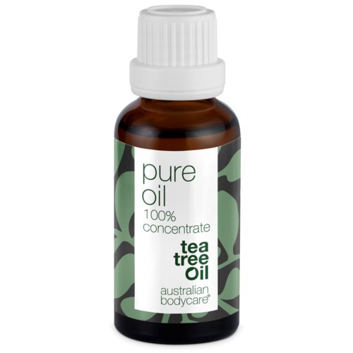 En liten brun flaska med vit kork, märkt "Pure Oil, Tea Tree Oil, 100% concentrate."