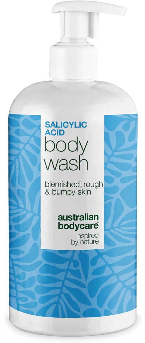 Näkyvä pumppupullo, merkitty 'Salicylic Acid Body Wash' karkealle iholle, sininen lehtikuvio ja vihreä teksti.