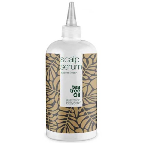 A white bottle with a dropper cap, labeled as scalp serum with tea tree oil, decorated with a leaf pattern.