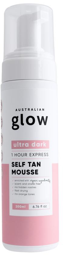Valkoinen pullo, jossa on pinkki ja musta teksti, merkitty itseruskekoeleksi tummalle iholle, Australian Glow -tuotemerkki.