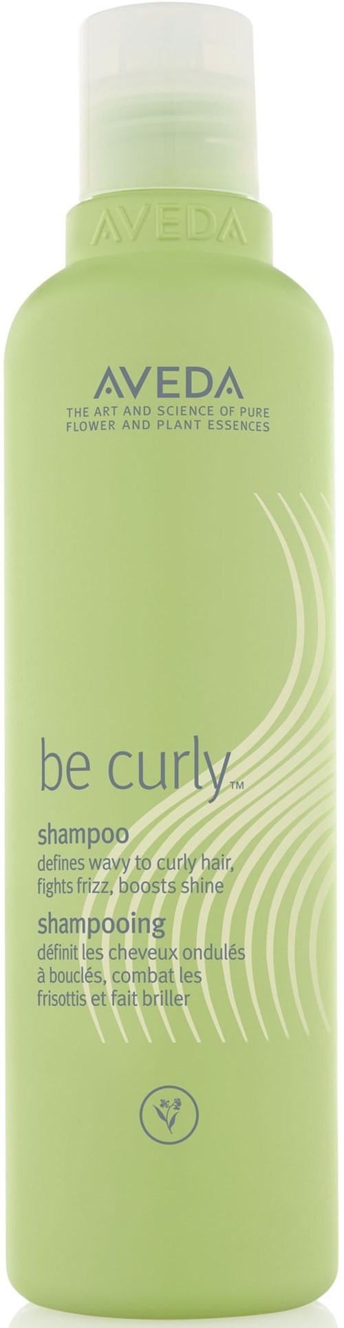 En grønn flaske med Aveda be curly sjampo med tekst om hårfordeler og ingredienser.