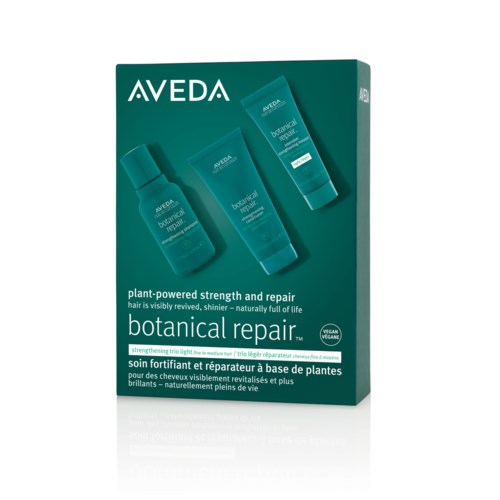 Grønn emballasje med tre flasker av Aveda botanical repair hårpleieprodukt. Teksten fremhever styrke og reparasjon for håret.