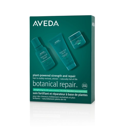 En eske med Aveda botanical repair hårprodukter med flasker og en krukke, som fremmer plantebasert styrke og glans.