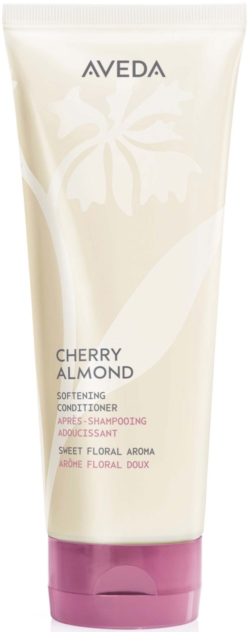 Aveda Cherry Almond rauhoittava hoitoaine valkoisessa ja violetissa putkilossa, jossa on puu-logo.