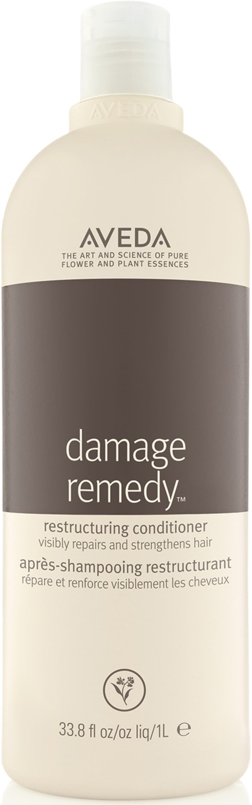 AAVEDA Damage Remedy genopbyggende balsamflaske med hvid og brun etiket. Den genopretter og styrker håret.