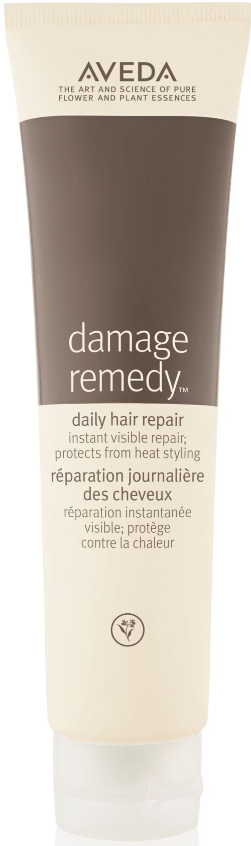 En tub med Aveda damage remedy-hårreparatör med enkel design, huvudsakligen beige och bruna färger, och text som beskriver dess användning.