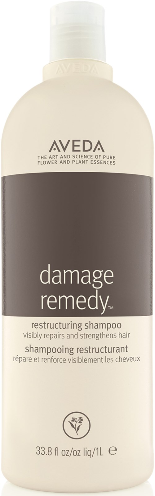 En hvit flaske med en brun etikett, kalt 'damage remedy', ser ut til å være en hårshampo-flaske.