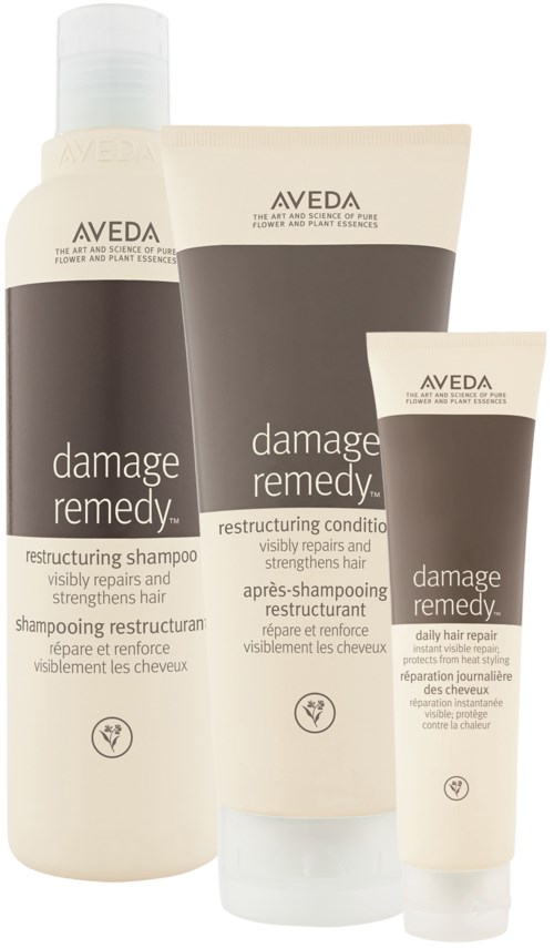 Tre hårvårdsprodukter: schampo, balsam och behandling för skadat hår. Alla är från Avedas Damage Remedy-serie.