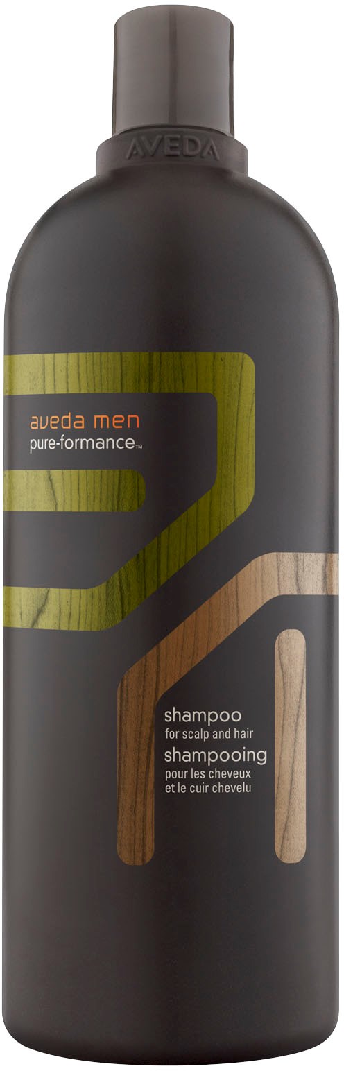 En svart flaske med Aveda Men sjampo med gul og brun design, merket for hodebunn og hårvask.