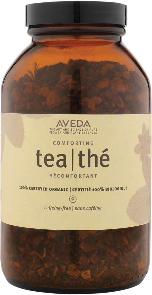 Brun flaske med lys etikett. Etiketten har tekst: 'AVEDA', 'tea|thé', 'comforting' og nevner økologisk og koffeinfritt.