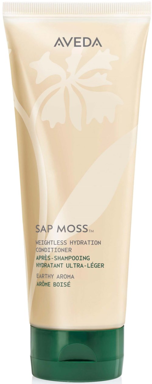 Puteli, jossa lukee Aveda Sap Moss ja logo kukasta ja kasvista, viestii kosteutta ja maan tuoksua.