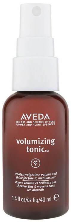 Aveda volumizing tonic spray in a brown bottle with a white spray top.