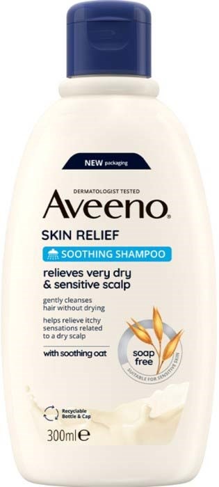 En vit flaska med Aveeno lugnande schampo med blå kork och etikett, som visar havre och en tvålfri symbol.