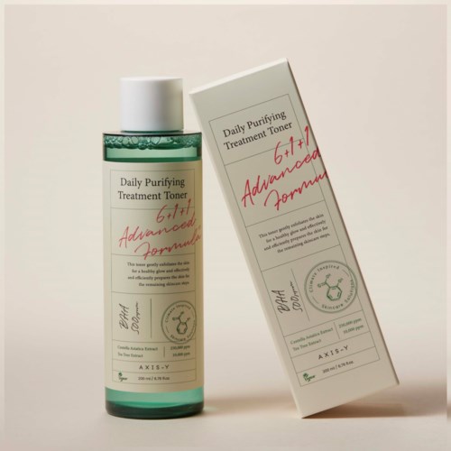 A bottle and box of a skincare toner labeled 'Daily Purifying Treatment Toner' with other text and a seal.