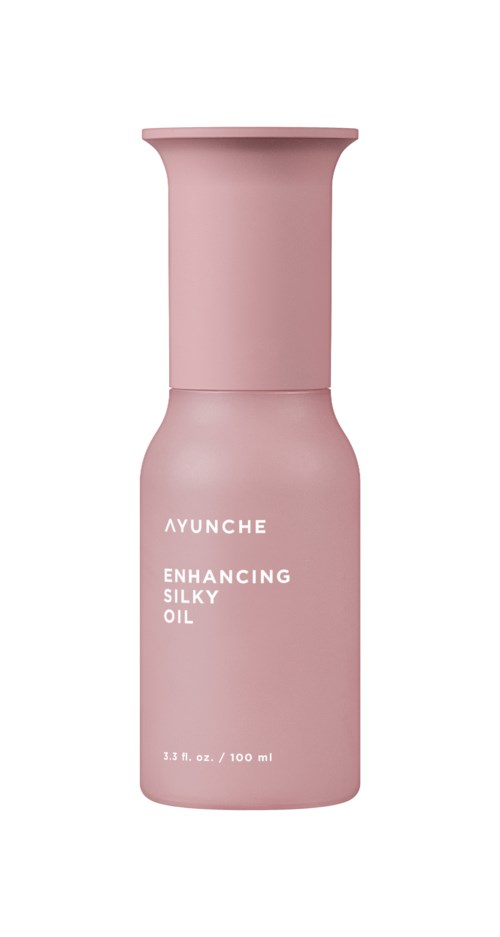 Różowa butelka oznaczona 'Ayunche Enhancing Silky Oil', pojemność 100 ml.