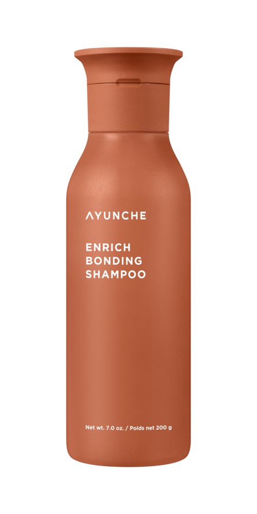 Wysoka, brązowa butelka z wąskim szyjkiem, z napisem 'AYUNCHE ENRICH BONDING SHAMPOO' w białym tekście.