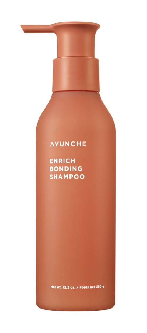 Różowa butelka szamponu z pompką, oznaczona 'AYUNCHE ENRICH BONDING SHAMPOO', i wagą netto 13,2 oz.