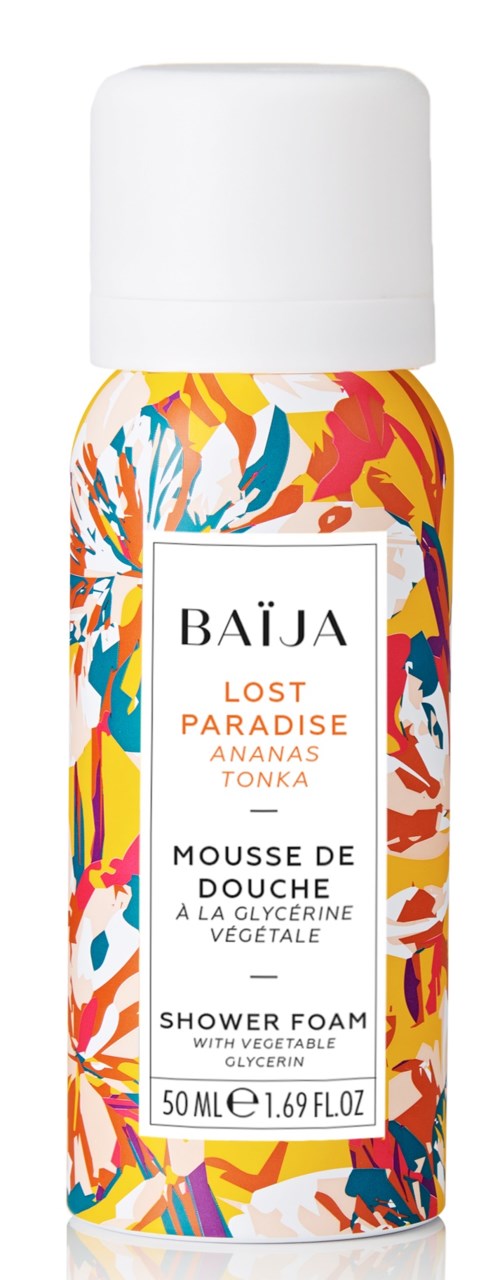 En flaska Baïja Lost Paradise duschskum med färgglad tropisk bladdesign och vitt lock.
