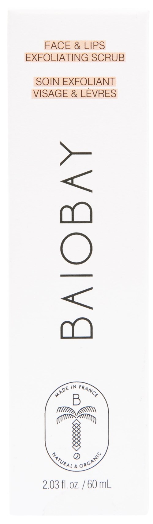 En vit flaska med svart och orange text för ansikts- och läppskrubb, märkt Baioby, med logotyp och volymuppgifter.