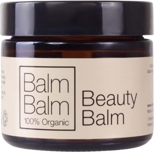 En mörkbrun burk med svart lock innehåller kräm märkt 'Beauty Balm' och '100% Organic'.