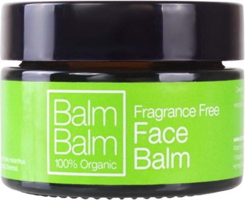 Vihreä purkki, jossa lukee 'Balm Balm Face Balm, Fragrance Free, 100% Organic.' Musta kansi päällä.