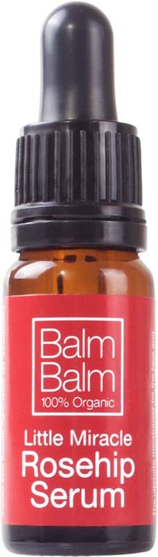 Kleine braune Flasche mit Pipette, beschriftet 'Little Miracle Rosehip Serum'.