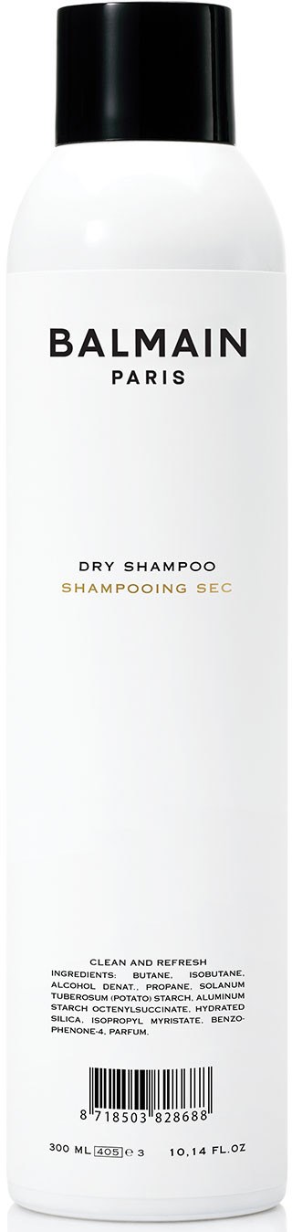 A tall white bottle of Balmain Paris dry shampoo with a black cap and simple text.