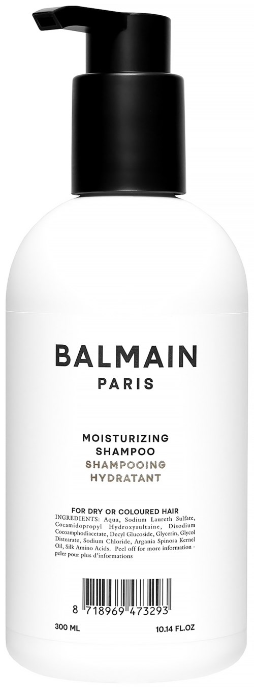 En vit flaska med svart pump märkt Balmain Paris, återfuktande schampo för torrt eller färgat hår, 300 ml.