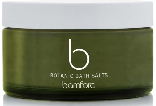 En grön burk med vit lock, märkt "Botanic Bath Salts" av Bamford.