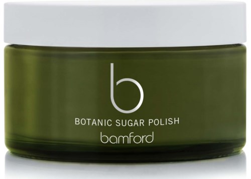 En grön burk märkta 'Botanic Sugar Polish' av Bamford med vit lock.