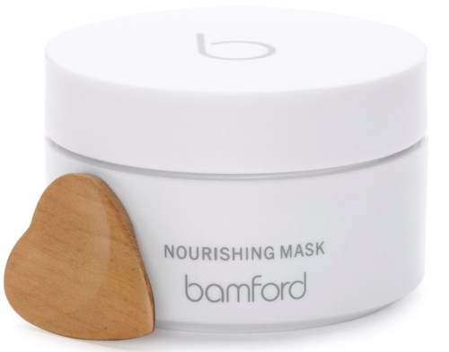 En hvit krukke merket "Nourishing Mask Bamford" med et lite trehjerte ved siden av.