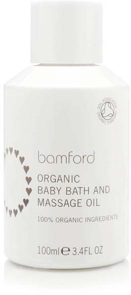 Vit flaska med Bamford ekologisk barnbad- och massageolja med hjärtdesign och enkel text.