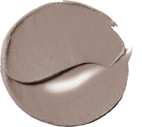 En taupefärgad makeup eller kräm i en cirkulär form med ett slätt, blandat utseende.