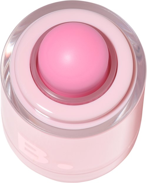 A pink, round device on a clear stand, possibly a beauty or skincare tool.
