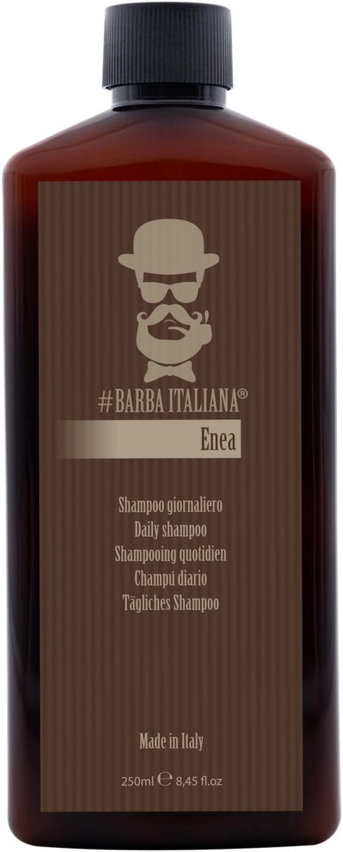 Ruskea pullo, jossa etiketti kuvalla partaisesta miehestä hatussa ja silmälaseissa. Se on italialainen shampoopullo.