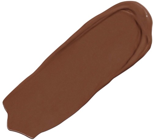 En brun smet av krämig makeup eller färg på en vit bakgrund.