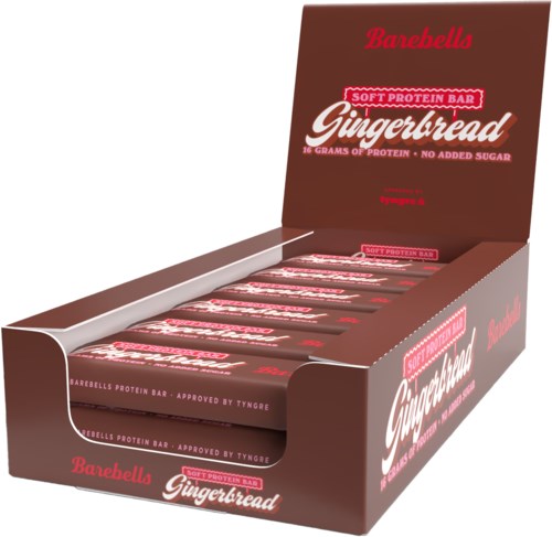 En utstillingsboks med flere Gingerbread-proteinstaver med rød og hvit emballasje i en brun eske.