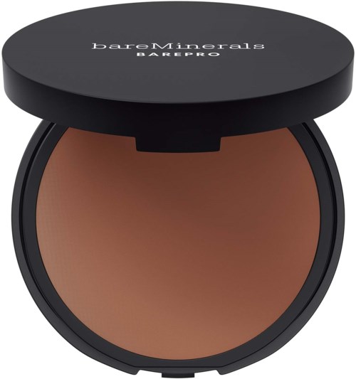 A round makeup compact with brown powder inside and a black lid showing brand names.