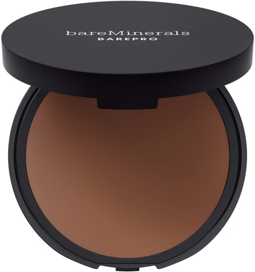 A round, open makeup compact with brown powder inside and a black lid labeled "bareMinerals BAREPRO."