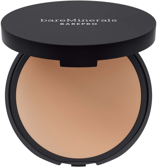 A round container with beige makeup inside and a black lid that says 'bareMinerals BAREPRO' on top.