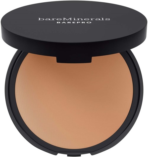 En liten rund makeupbehållare öppen för att visa beige puder inuti. Locket har varumärket 'bareMinerals BAREPRO' på toppen.