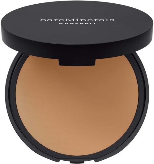 A circular compact with tan-colored powder and a black lid labeled 'bareMinerals BAREPRO' on top.