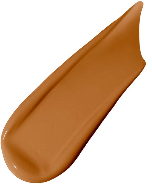 Ett streck av chokladpålägg med spetsig ände mot en vit bakgrund.